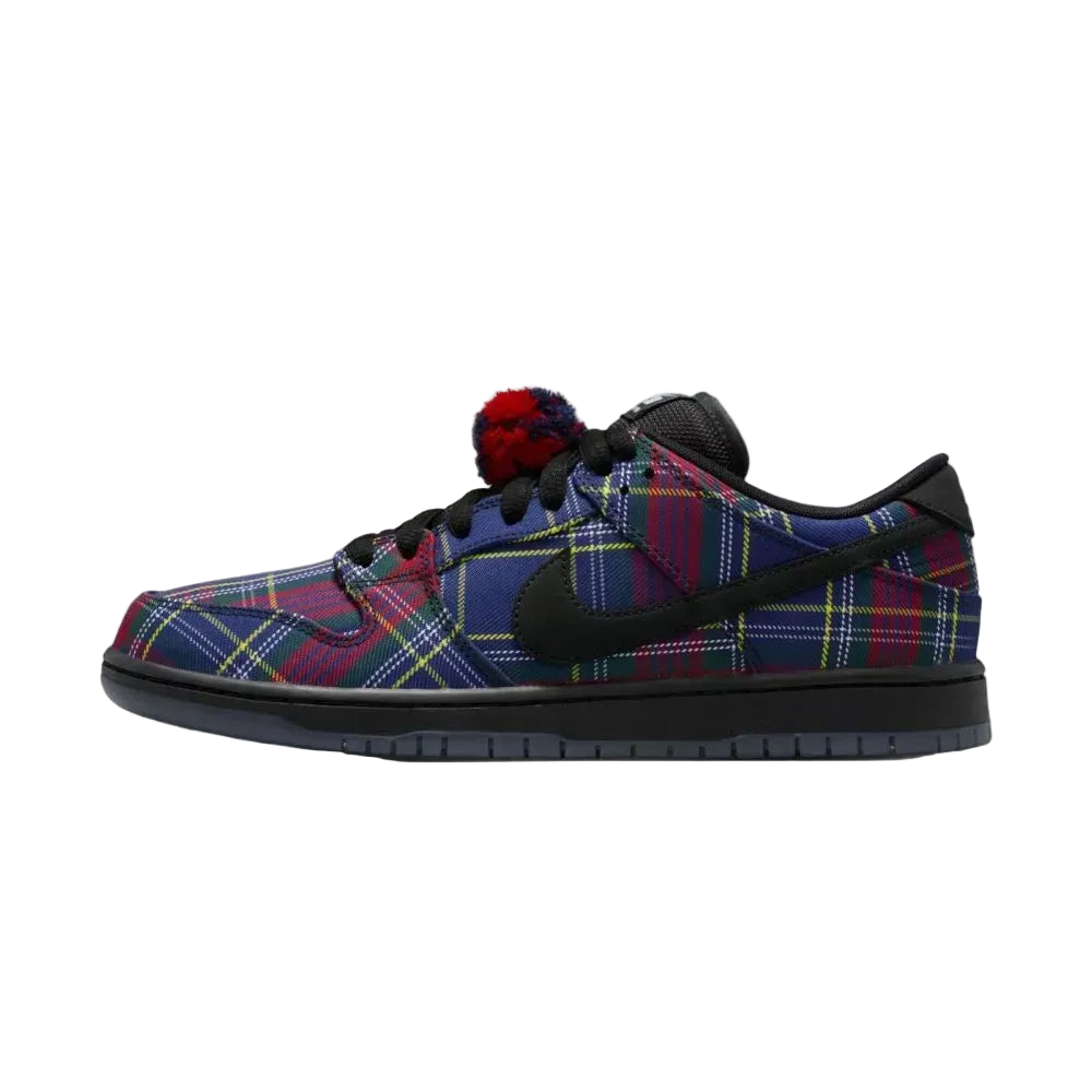Plaid patterned sneaker with a black swoosh logo on a white background